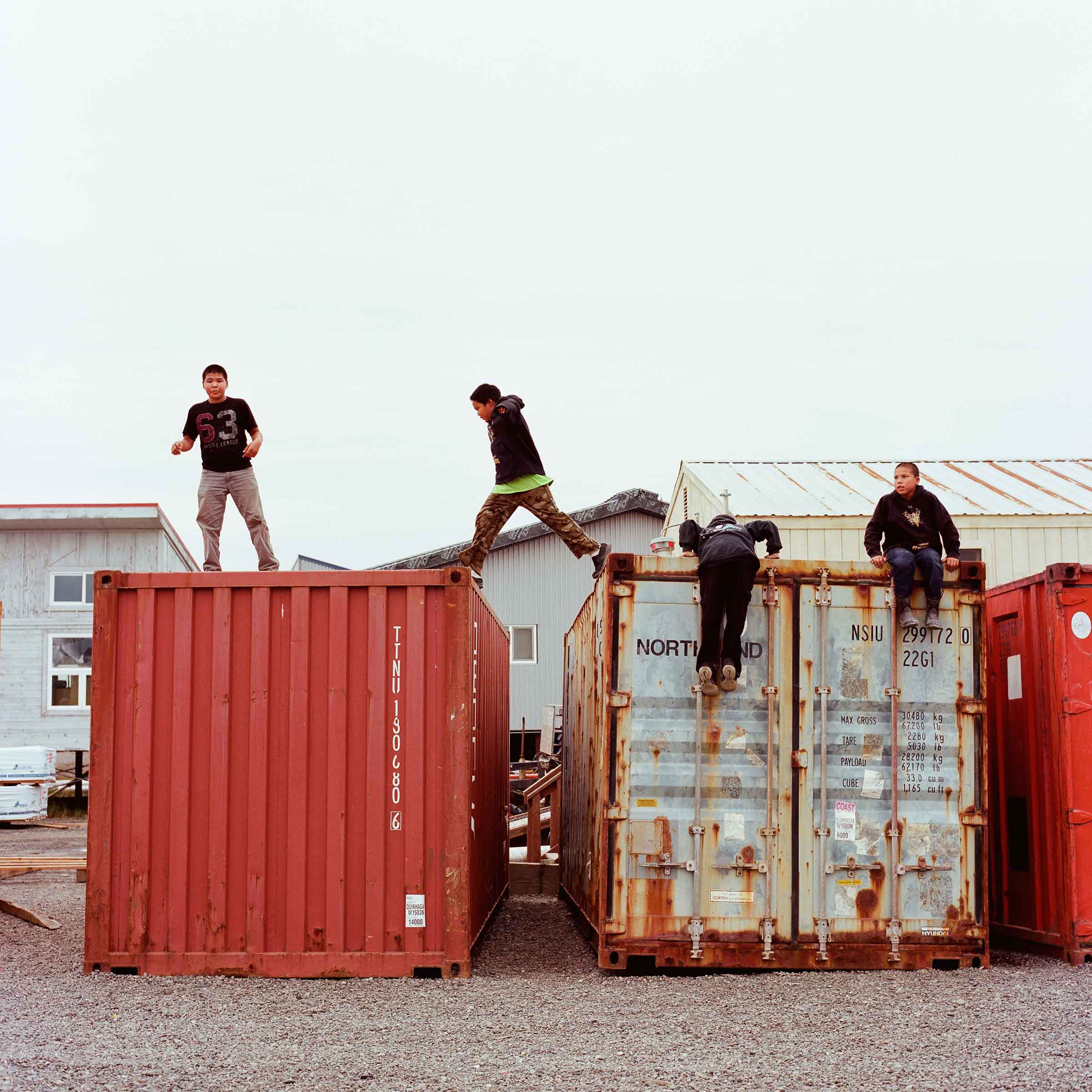 Kids playing on shipping containers